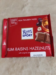 Шоколад Ritter Sport Молочный с ямайским ромом, изюмом и орехами 100 г (4000417012005/4000417601216) фото от покупателей 3