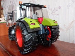 Спецтехника Bruder трактор Claas Axion 950 с погрузчиком (03013) фото от покупателей 1
