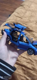Машинка Tesla Model X колекційна моделька металева іграшка 15 см Фіолетовий (3532849) фото від покупців 2