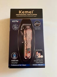 Профессиональная аккумуляторная машинка для стрижки волос Kemei KM-2616 с функцией триммера и 6 насадками фото от покупателей 5