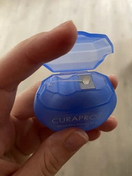 Зубная нить Curaprox вощеная с ароматом мяты 50 м (7612412428285) фото от покупателей 1