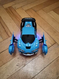 Машинка трансформер на радіокеруванні AToys Bugatti-Robot 1:18 світлові ефекти Чорно-блакитна фото від покупців 5