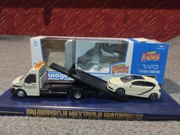 Ігровий набір Bburago автоперевізник з автомоделлю VW Polo Gti Mark 5 (18-31403) (4893993314034) фото від покупців 2