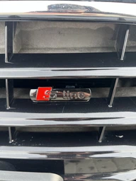 Эмблема Audi S-line на решётку радиатора 72*17 мм чёрный глянец