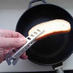 Ручка-прихват для гарячого посуду та продуктів із зубцями для надійної фіксації з алюмінієвого сплаву, Сріблястий фото від покупців 1