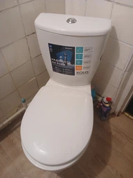 Унитаз напольный белый KOLO Antisplash с крышкой выпуск косой 209905UA