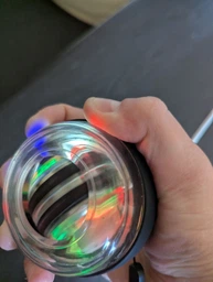 Эспандер гироскопический кистевой тренажер силы хвата Powerball GyroBall гиробол павербол вращающийся шар антистресс реабилитационный после травм предплечья запястья нескользящий корпус спортивный фитнес тренировка кисти руки с кейсом черный Art Planet фото от покупателей 1