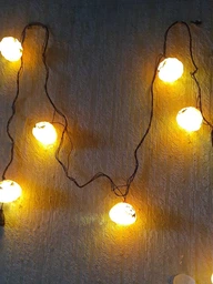 Светодиодная гирлянда "Хеллоуин тыква" 12 LED, 5м + переходник, черный провод, 220V, IP44, Теплый белый фото от покупателей 1