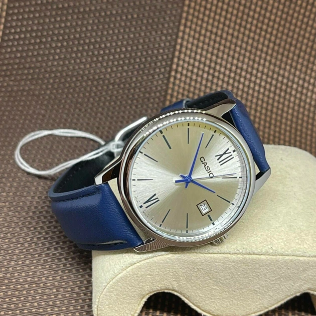 Сріблястий годинник Casio MTP-V002L-2B3 UDF з синім ремінцем - це наручні аксесуари. - Фото 3 Сріблястий годинник Casio MTP-V002L-2B3 UDF з синім ремінцем - це наручні аксесуари. - зображення 3