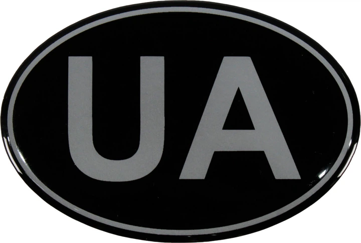 Наклейка UA (овал на черном фоне) (силикон) 8,3x5,6 (68-51) - Фото 1 Наклейка UA (овал на черном фоне) (силикон) 8,3x5,6 (68-51) - изображение 1