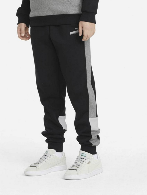 Дитячі теплі спортивні штани на флісі для хлопчика Puma Ess+ Colorblock Pants Fl Cl B 849083-01 104 см Чорні (4064535821499) - зображення 1