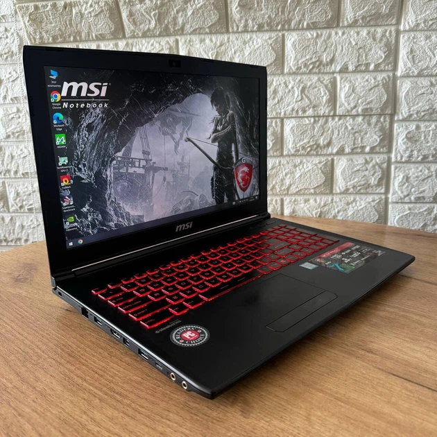 Ігровий ноутбук MSI GL62M 7REX / 15.6" (1920x1080) TN / Intel Core i7-7700HQ (4 (8) ядра по 2.8 - 3.8 GHz) / 8 GB DDR4 / 128 GB SSD M.2 + 1000 GB HDD / nVidia GeForce GTX 1050 Ti, 4 GB GDDR5, 128-bit / WebCam б/в - Фото 4 Ігровий ноутбук MSI GL62M 7REX / 15.6" (1920x1080) TN / Intel Core i7-7700HQ (4 (8) ядра по 2.8 - 3.8 GHz) / 8 GB DDR4 / 128 GB SSD M.2 + 1000 GB HDD / nVidia GeForce GTX 1050 Ti, 4 GB GDDR5, 128-bit / WebCam б/в - зображення 4