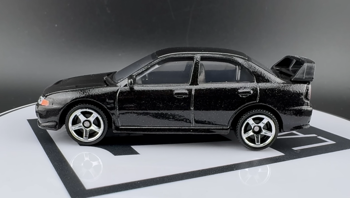 Тематична Машинка Matchbox Mitsubishi 1996 Mitsubishi Lancer Evolution IV Moving Parts 1:64 FWD28/HVM98 Black - зображення 5