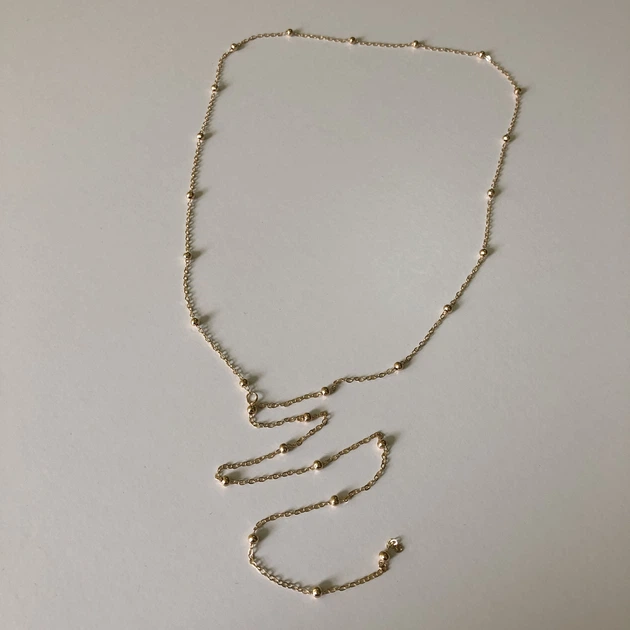 Тонке кольє-краватка «Silver Dew» з делікатними металевими кульками Honey Fashion Accessories золотистий (120198) - Фото 4 Тонке кольє-краватка «Silver Dew» з делікатними металевими кульками Honey Fashion Accessories золотистий (120198) - зображення 4