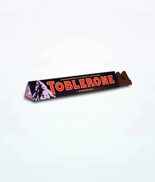 Шоколад черный Toblerone с медом и миндальной нугой 100 г - Фото 1 Шоколад черный Toblerone с медом и миндальной нугой 100 г - изображение 1