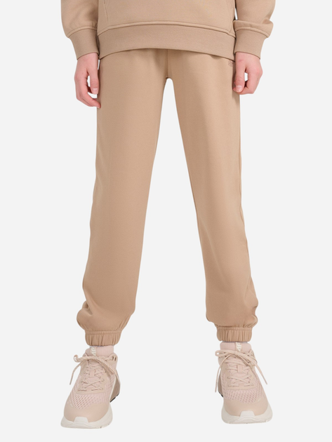 Spodnie dresowe dziewczęce joggery 4F 4FJWSS25TTROF1187-83S 122 cm Beżowe (5905700426189) - obraz 1