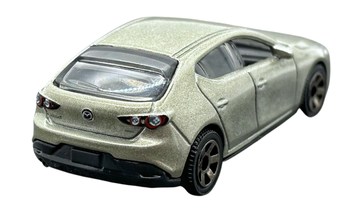 Машинка Большой Город Matchbox 2019 Mazda 3 Road Trip 1:64 HVP04 Gold - Фото 4 Машинка Большой Город Matchbox 2019 Mazda 3 Road Trip 1:64 HVP04 Gold - изображение 4