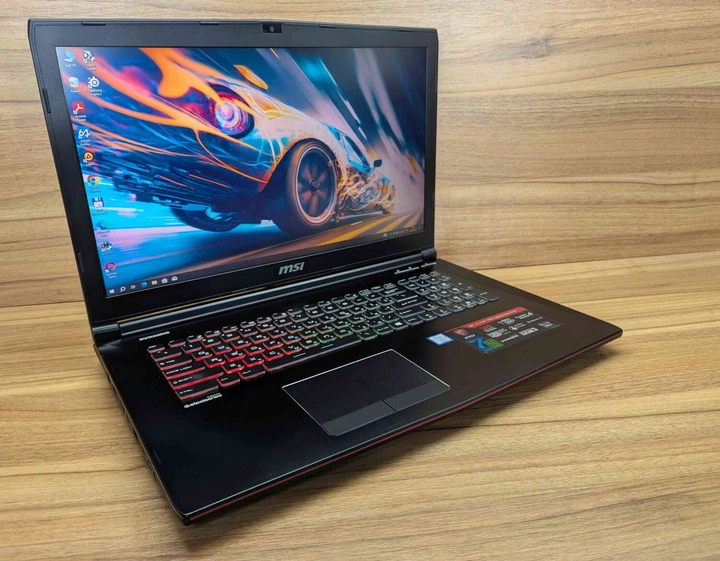 Ігровий ноутбук MSI GE72MVR / 17.3" (1920x1080) IPS / Intel Core i7-7700HQ (4 (8) ядра по 2.8 - 3.8 GHz) / 32 GB DDR4 / 256 GB SSD + 1000 GB HDD / nVidia GeForce GTX 1070, 8 GB GDDR5, 256-bit / WebCam / Windows 10 б/в - Фото 4 Ігровий ноутбук MSI GE72MVR / 17.3" (1920x1080) IPS / Intel Core i7-7700HQ (4 (8) ядра по 2.8 - 3.8 GHz) / 32 GB DDR4 / 256 GB SSD + 1000 GB HDD / nVidia GeForce GTX 1070, 8 GB GDDR5, 256-bit / WebCam / Windows 10 б/в - зображення 4