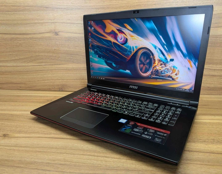 Ігровий ноутбук MSI GE72MVR / 17.3" (1920x1080) IPS / Intel Core i7-7700HQ (4 (8) ядра по 2.8 - 3.8 GHz) / 32 GB DDR4 / 256 GB SSD + 1000 GB HDD / nVidia GeForce GTX 1070, 8 GB GDDR5, 256-bit / WebCam / Windows 10 б/в - Фото 5 Ігровий ноутбук MSI GE72MVR / 17.3" (1920x1080) IPS / Intel Core i7-7700HQ (4 (8) ядра по 2.8 - 3.8 GHz) / 32 GB DDR4 / 256 GB SSD + 1000 GB HDD / nVidia GeForce GTX 1070, 8 GB GDDR5, 256-bit / WebCam / Windows 10 б/в - зображення 5