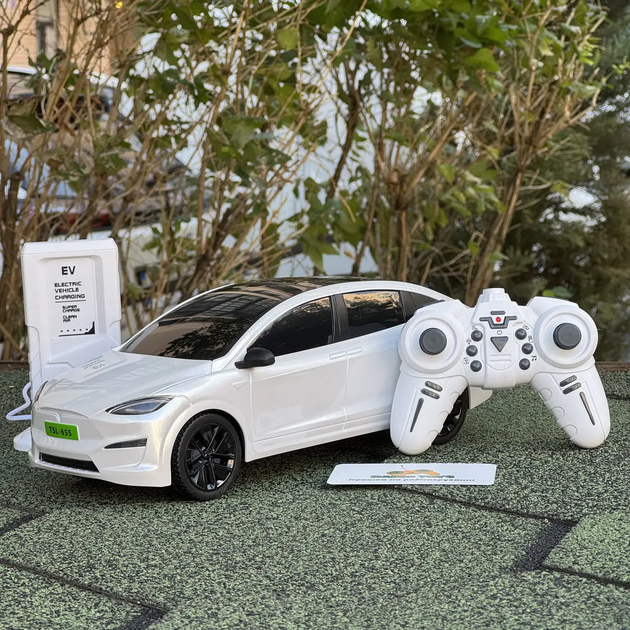 Інерційна металопластикова машинка PM3417 Tesla Model Х на радіокеруванні з зарядною станцією Біла - Фото 1 Інерційна металопластикова машинка PM3417 Tesla Model Х на радіокеруванні з зарядною станцією Біла - зображення 1