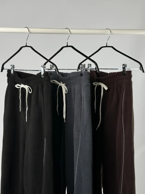 Жіночі широкі штани з флісу зі світловідбиваючим кантом K5 fashion 46-48 чорні - Фото 4 Жіночі широкі штани з флісу зі світловідбиваючим кантом K5 fashion 46-48 чорні - зображення 4