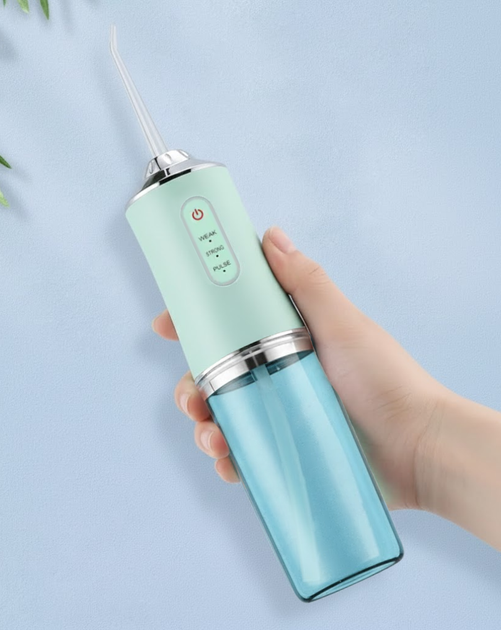 Ирригатор для полости рта ORAL IRRIGATOR 3 режима с насадками зеленый - изображение 5