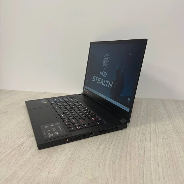 Ігровий ноутбук MSI GS66 Stealth 11UH / 15.6" (1920x1080) IPS / Intel Core i9-11900H (8 (16) ядер по 2,5 - 4,9 ГГц) / 16 ГБ DDR4 / 512 ГБ SSD / nVidia GeForce RTX 3080, 16 ГБ GDDR6, 256-біт / WebCam б/в - Фото 5 Ігровий ноутбук MSI GS66 Stealth 11UH / 15.6" (1920x1080) IPS / Intel Core i9-11900H (8 (16) ядер по 2,5 - 4,9 ГГц) / 16 ГБ DDR4 / 512 ГБ SSD / nVidia GeForce RTX 3080, 16 ГБ GDDR6, 256-біт / WebCam б/в - зображення 5