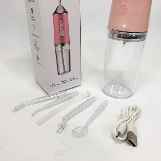 Ирригатор для чистки зубов и полости рта Oral Irrigator с аккумулятором и сменными насадками Pink - Фото 2 Ирригатор для чистки зубов и полости рта Oral Irrigator с аккумулятором и сменными насадками Pink - изображение 2