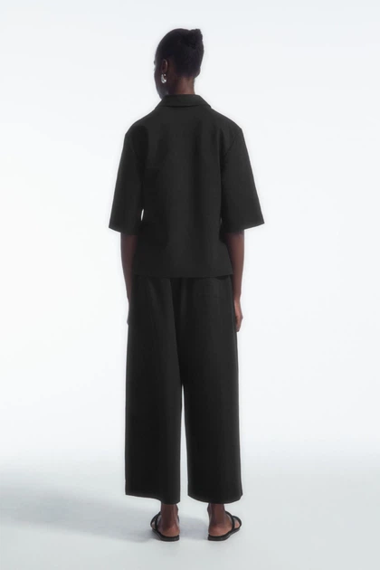 Сорочка жіноча COS jersey polo shirt 1247373001 XS Чорний - Фото 4 Сорочка жіноча COS jersey polo shirt 1247373001 XS Чорний - изображение 4
