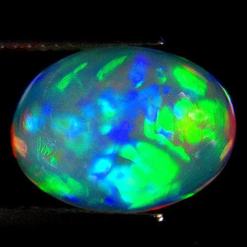 Эфиопский опал кабошон 4.96Ct 14.07 x 10.28 x 7.72 mm (140395) - Фото 1 Эфиопский опал кабошон 4.96Ct 14.07 x 10.28 x 7.72 mm (140395) - изображение 1