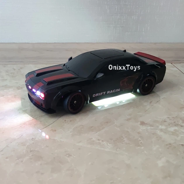 Машинка для дрифта на радиоуправлении Dodge Challenger Hellcat 4WD 1:14 с паром, неоновой подсветкой, сменными колесами, 27 см (Black) - изображение 7