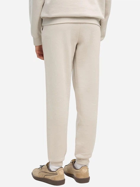 Дитячі спортивні штани-джогери для дівчинки Puma Essentials 68489882 122-128 см Бежеві (4070033474198) - Фото 2 Дитячі спортивні штани-джогери для дівчинки Puma Essentials 68489882 122-128 см Бежеві (4070033474198) - зображення 2