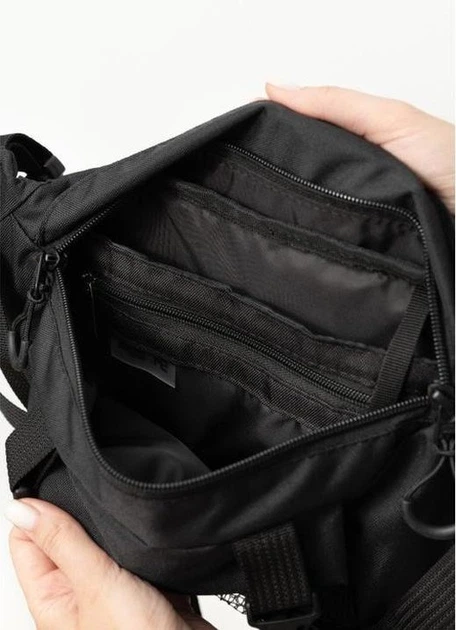 Велика жіноча поясна сумка бананка з поліестеру міська Sambag DynamicDart трансформер, чорна 60506 - Фото 10 Велика жіноча поясна сумка бананка з поліестеру міська Sambag DynamicDart трансформер, чорна 60506 - зображення 10