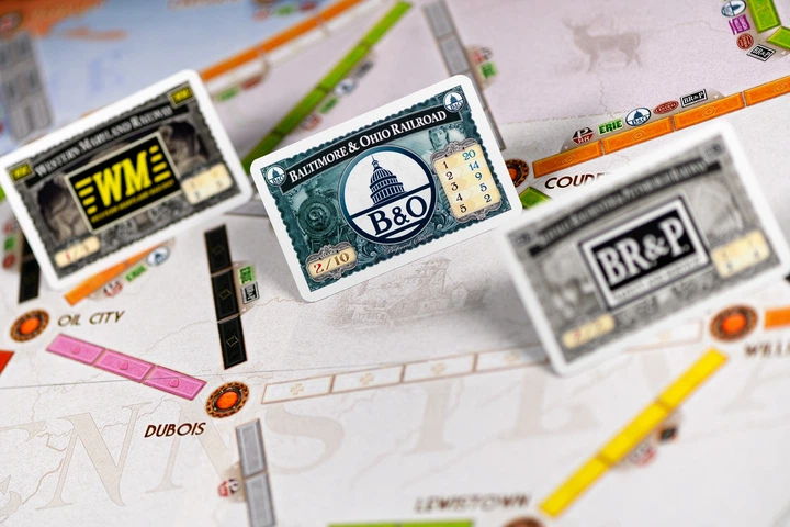 Dodatek do gry planszowej Rebel Wsiąść do Pociągu: Kolekcja Map 5 - Zjednoczone Królestwo i Pensylwania (0824968721230) - Zdjęcie 10 Dodatek do gry planszowej Rebel Wsiąść do Pociągu: Kolekcja Map 5 - Zjednoczone Królestwo i Pensylwania (0824968721230) - obraz 10