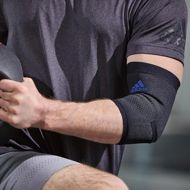 Фіксатор Ліктя Adidas Performance Elbow Support(ADSU-13331BL) M Чорний/Синій - Фото 6 Фіксатор Ліктя Adidas Performance Elbow Support(ADSU-13331BL) M Чорний/Синій - изображение 6