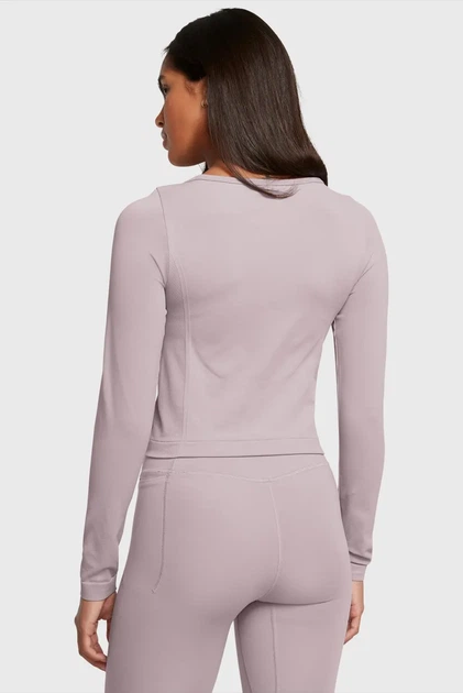 Жіночий пудровий лонгслів UA Vanish Seamless LS Under Armour L 1379150-015 - Фото 3 Жіночий пудровий лонгслів UA Vanish Seamless LS Under Armour L 1379150-015 - зображення 3
