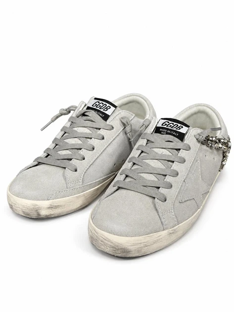Женские кеды Golden Goose белые с перфорацией, серебристой блестящей звездой и серыми шнурками размер 42 - Фото 1 Женские кеды Golden Goose белые с перфорацией, серебристой блестящей звездой и серыми шнурками размер 42 - изображение 1