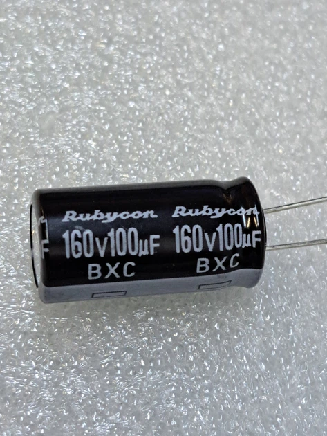Конденсатор электролитический 100 mkF 160V 105С Rubycon (12,5mm*25mm) (КЕ0082) - Фото 1 Конденсатор электролитический 100 mkF 160V 105С Rubycon (12,5mm*25mm) (КЕ0082) - изображение 1
