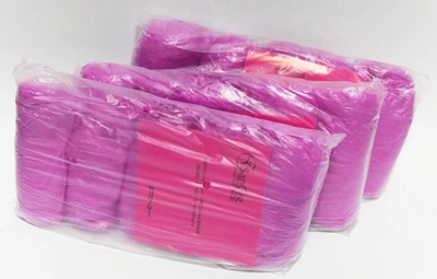 Бахили одноразові SanGig рожеві поліетиленові 3,5 гр 100 штук в упаковці 50 пар