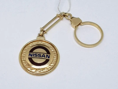 Золотой брелок NISSAN. 5221550
