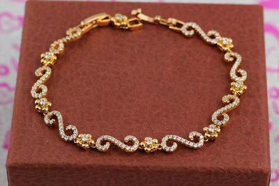 Браслет Xuping Jewelry цветочный завиток 19.5 см золотистый