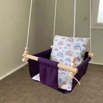 Дитяча гойдалка Infancy Веселки підвісна з натурального дерева фіолетова тканинна основа від 7 місяців до 5 років.