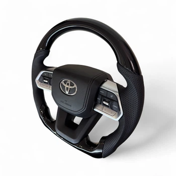 Анатомический руль для Toyota Tundra. Рояльный лак. Кнопки и логотип - хром. В сборе.