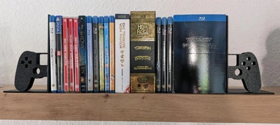 Держатель для игровых дисков в форме геймпадов