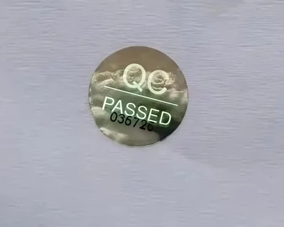 Наклейки гарантійні круглі QC PASSED номерні