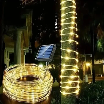 Светодиодная гирлянда "Трубка" 20м 200 LED теплый белый от солнечной батареи на улице в саду.