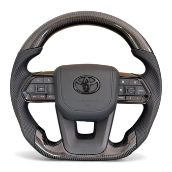 Анатомический руль для Toyota Land Cruiser 100, Prado 120. Карбон. Подушка из кожи - черный логотип. В сборе.