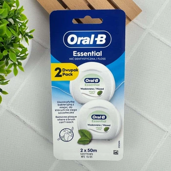 Зубная нить Oral-B Essential Floss Mint 50 м вощеная мятная для очистки межзубных промежутков, 2*50 м