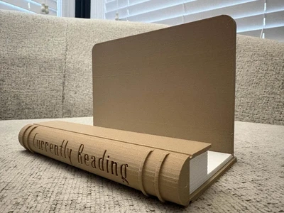 Підставка для книги 'Currently Reading' у вигляді книжкового корінця. Aivory