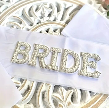 Стрічка атласна весільна для нареченої Bride біла з камінцями та намистинами 1шт